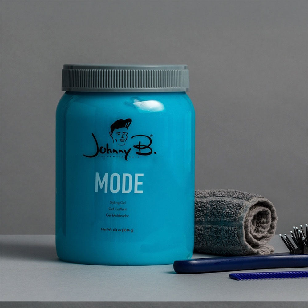Johnny B Mode styling product in 64 oz bottle, featuring sleek packaging and professional hair styling formula.