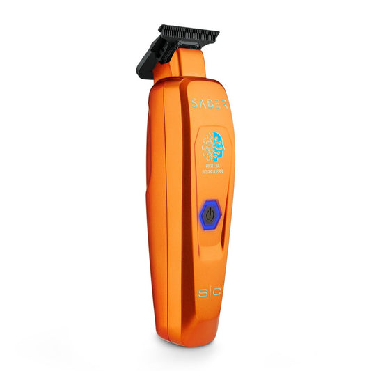 Orange StyleCraft Saber Trimmer for precise hair trimming and grooming, featuring a sleek design and ergonomic handle.