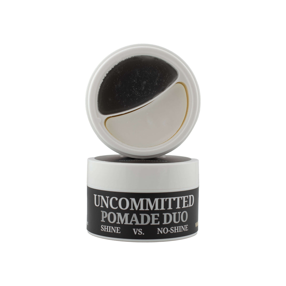 The Good Sh*t Mens Grooming Uncommitted Pomade Duo styling products for hold and shine, displayed in a natural setting.
