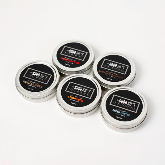 Beard balm from The Good Sh*t Mens Grooming with a container of beard butters on a neutral background.