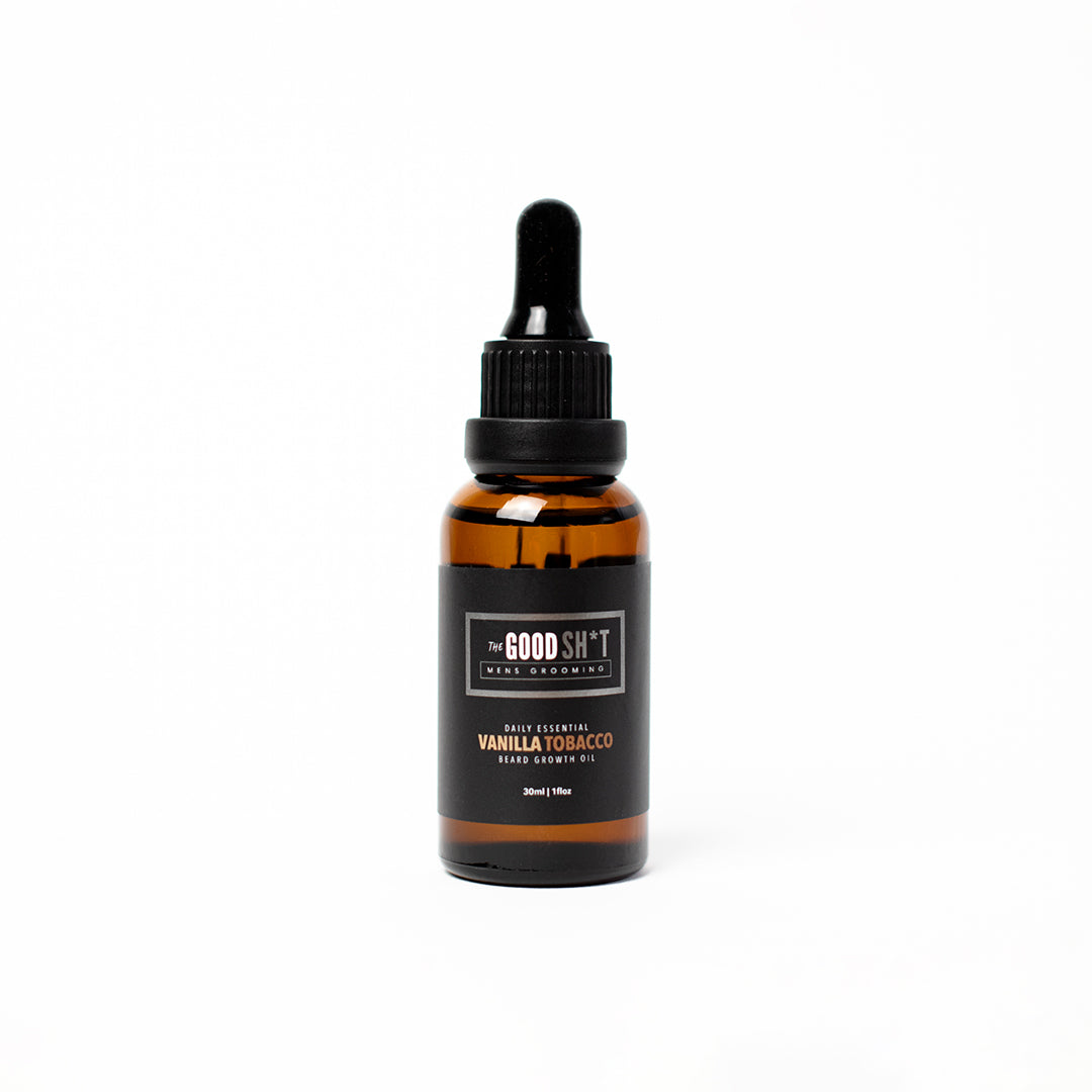 A bottle of The Good Sh*t pre-shave oil with vanilla and tobacco scent, designed for beard grooming and smooth shaving.