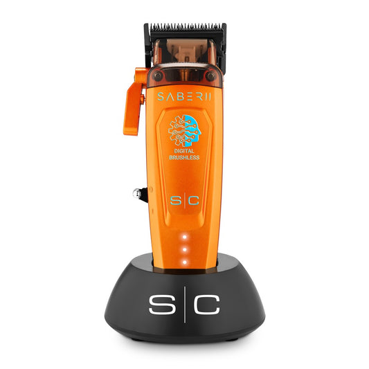Orange StyleCraft Saber 2.0 clipper on stand, professional hair clipper with ergonomic design for precise grooming.
