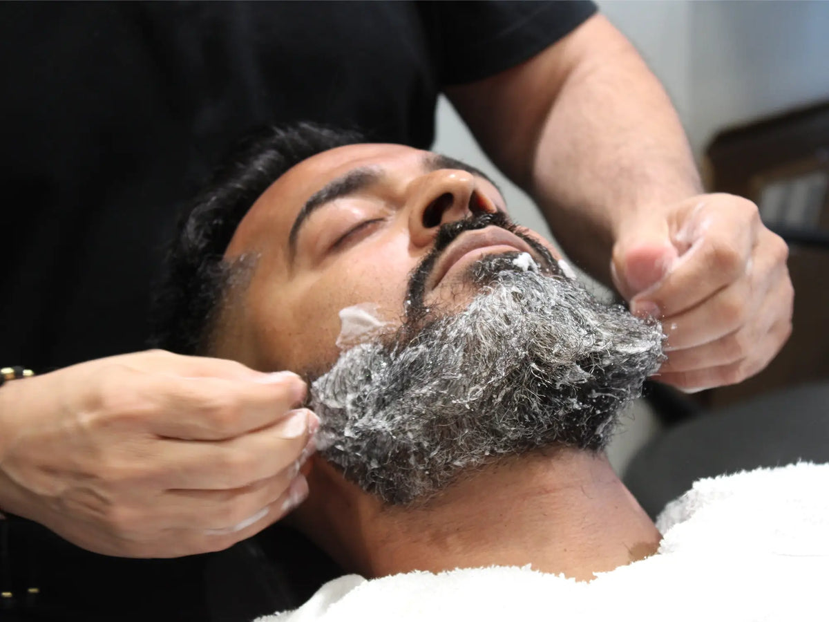 A 5oz bottle of The Good Sh*t Beard Wash from The Good Sh*t Men’s Grooming line, featuring the product label and packaging.