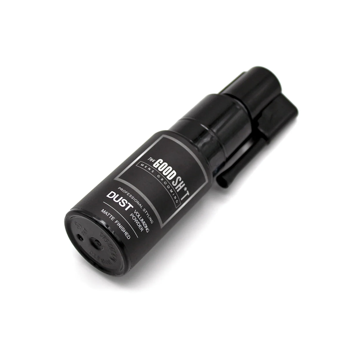 The Good Sh*t Dust Volumizing Powder for men's grooming, showing the product container and powder texture on a neutral background.