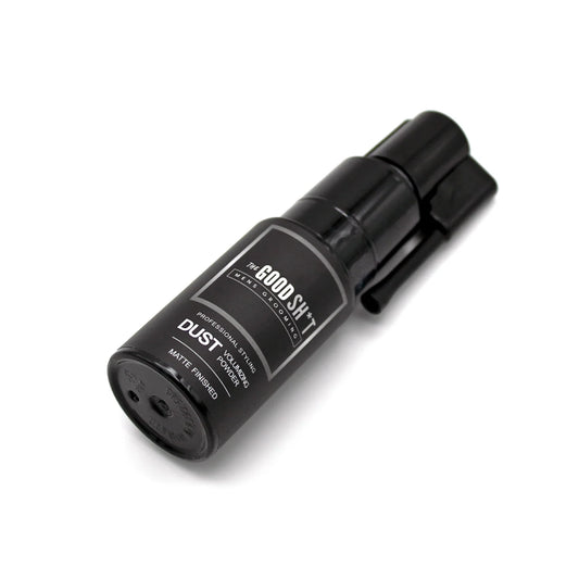 The Good Sh*t Dust Volumizing Powder for men's grooming, showing the product container and powder texture on a neutral background.