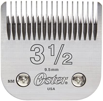 Oster detachable clipper blades, size 00000, showing sharp metal edges and adjustable attachment for grooming clippers.