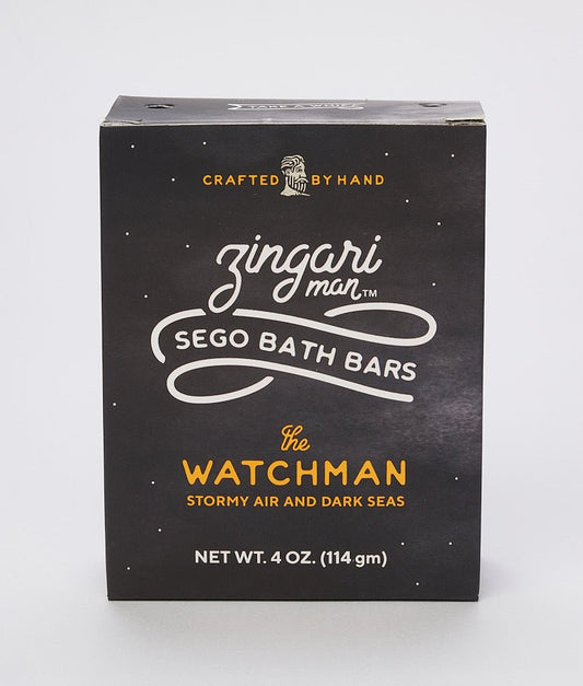Zingari Man The Watchman Bath Bar shampoo and conditioner bar shown in a natural setting with packaging and product details.